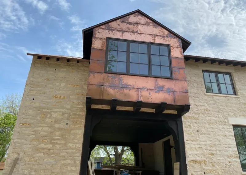 Copper metal panel facade on a stone building for Metal Roof Coating in Walnut Ridge