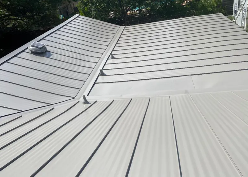 Solar attic fan installed on a metal roof for Roof Ventilation in Walnut Ridge